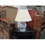 A modern ginger jar form blue and white table lamp base with shade