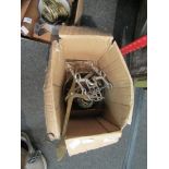 A box containing scales, copper lamp base,