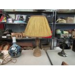 An onyx table lamp with pleated shade