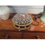 A Victorian brass footstool with floral beadwork