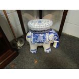 A blue and white ceramic elephant form jardiniere stand,