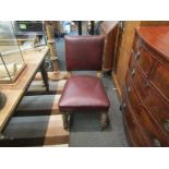 A set of three 1940's oak side chairs with red leather upholstery,