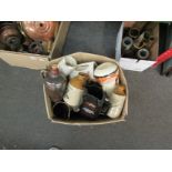 A box containing advertising jugs, Toby jugs,
