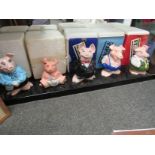 A set of five Wade NatWest piggy banks with rubber bungs