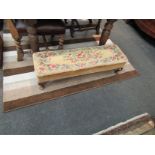 A needlepoint upholstered long stool on cabriole legs,