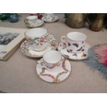 Three variously patterned Derby porcelain tea and coffee cups and saucers,