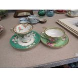 A Stevenson and Hancock Derby porcelain tea cup and saucer painted with bright summer flowers on an