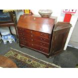 A George III mahogany bureau, the fall front over four long graduating drawers,