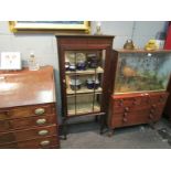 An Edwardian mahogany glazed display cabinet with astragal front, spade feet,