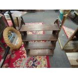 A late Victorian four tier wall shelf with pierced sides,