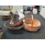 Two wicker baskets and a model ship