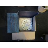 A box containing blue and white table wares, boxed plates and a Lladro paperweight,