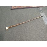 A cane swagger stick with resin knop in the form of a fist