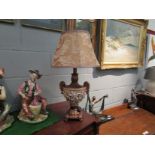 A pair of plaster urn form table lamps with floral shades