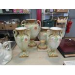 Two pairs of Japanese floral design vases, swan design handles and twin armed examples on bases,