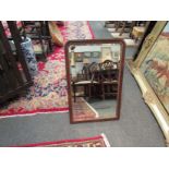 A Victorian mahogany and gilt bevelled wall mirror