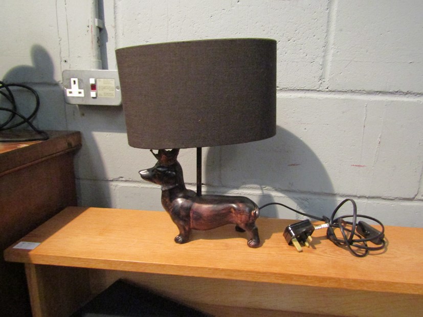 A table lamp as dachshund wearing crown,