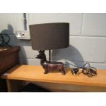 A table lamp as dachshund wearing crown,