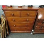 A Victorian mahogany round cornered chest of two short over three long drawers, bun handles,