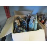 A box containing Chinese pottery figures including musicians, fishermen, etc.