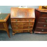 A Georgian style flame walnut bureau,