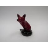 A Royal Doulton Flambé fox figure, 11.