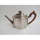 A Thomas Oliphant (or Ollivant) silver teapot with rubbed engraved foliate borders and cartouches,