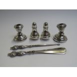 A pair of George V silver pepperettes of baluster form, London 1933. By Edward Barnard & Sons Ltd.