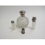 An Edwardian spherical cut glass dressing table scent bottle with silver lid. Birmingham 1901.