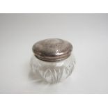 An American slice and tooth cut glass powder jar with engraved Gorham lid stamped "Sterling",