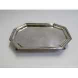 A George III silver waiter of canted rectangular form with reeded rim,