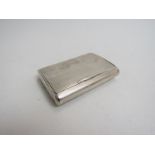 A George V silver tobacco box/card case of rectangular form with striped engine turned decoration.