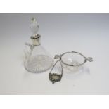 An Edwardian clear glass quaich with silver rim and pierced silver lug handles. London 1901.