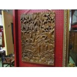 A 20th Century Indonesian carved wood panel,