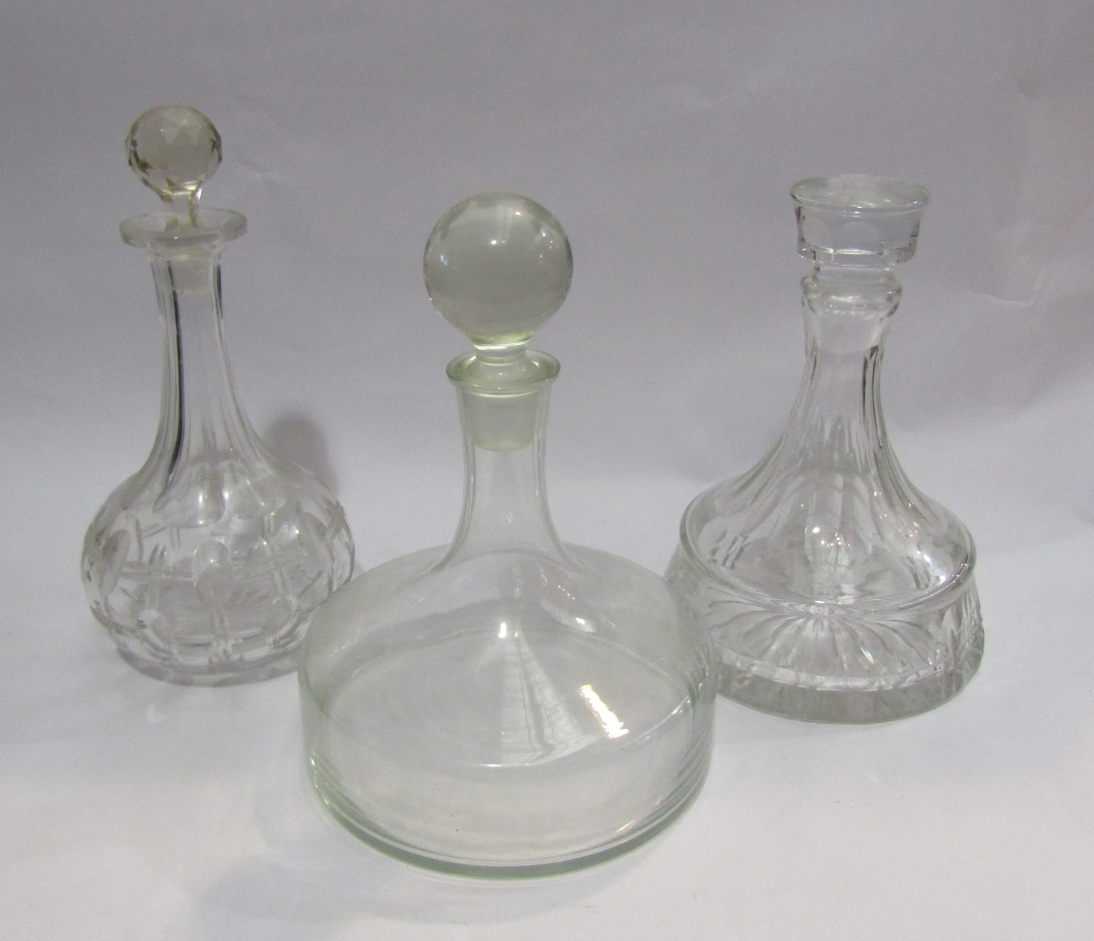 Three glass decanters including Dartington ship's decanter