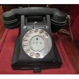 A vintage Bakelite dial telephone