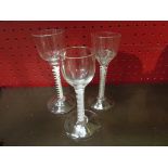 Three Georgian cordial glasses with air twist stems. one having chip to foot 13.