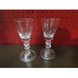 Two 19th Century conical bowl glasses with double knop stem to bell folded foot