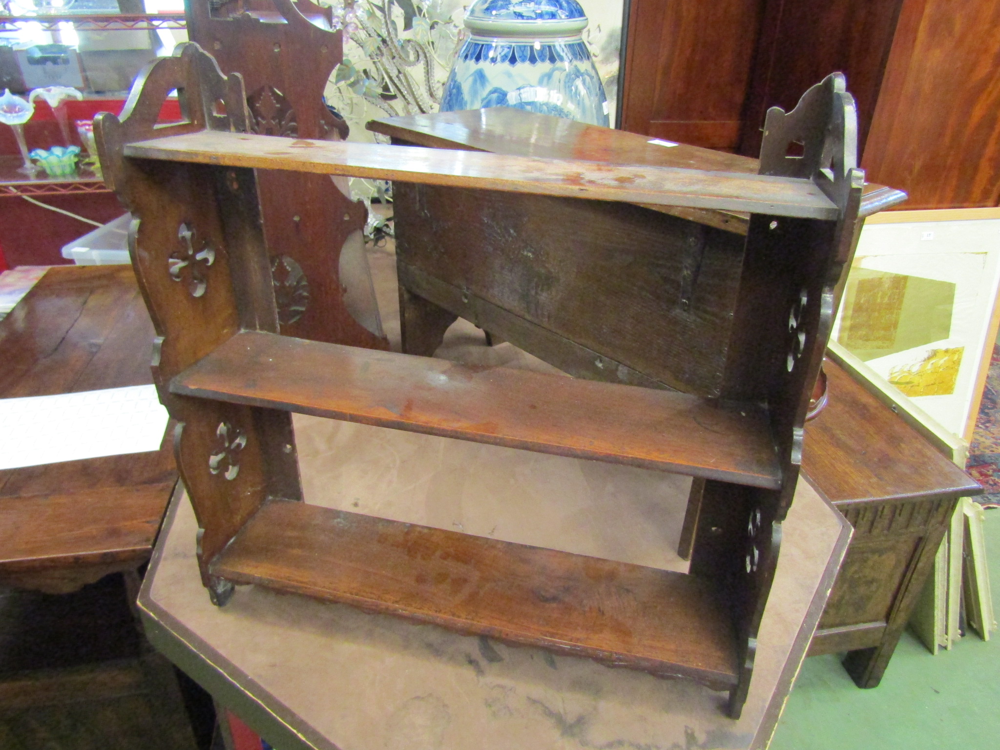 A Victorian mahogany fretwork three tier wall hanging shelf,