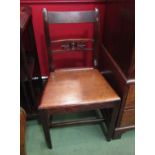 Circa 1820 a pair of fruitwood chairs with carved cross splat over a flat seat on square tapering