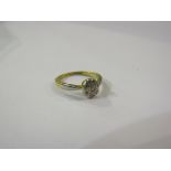 An 18ct gold platinum set diamond ring. Size I, 2.