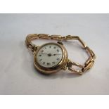 A vintage 9ct gold wristwatch with flexible strap