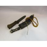 A ceremonial kukri with two smaller examples in a sheath and a WWII US dagger a/f