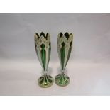A pair of Bohemian tulip form glass vases, green and white with applied gilt,