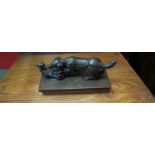 A late 19th Century bronze figure of hunting dog attacking a large cat,