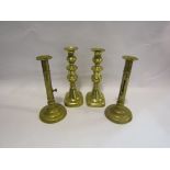 Two pairs of early/mid 19th Century brass ejector candlesticks