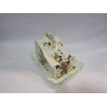A Victorian ceramic cheese dish and cover