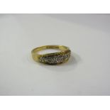 An 18ct gold ring set with white gold diamond set panel. Size O, 3.