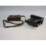 A circa 1912 Ensignette Anastigmat camera in a leather case