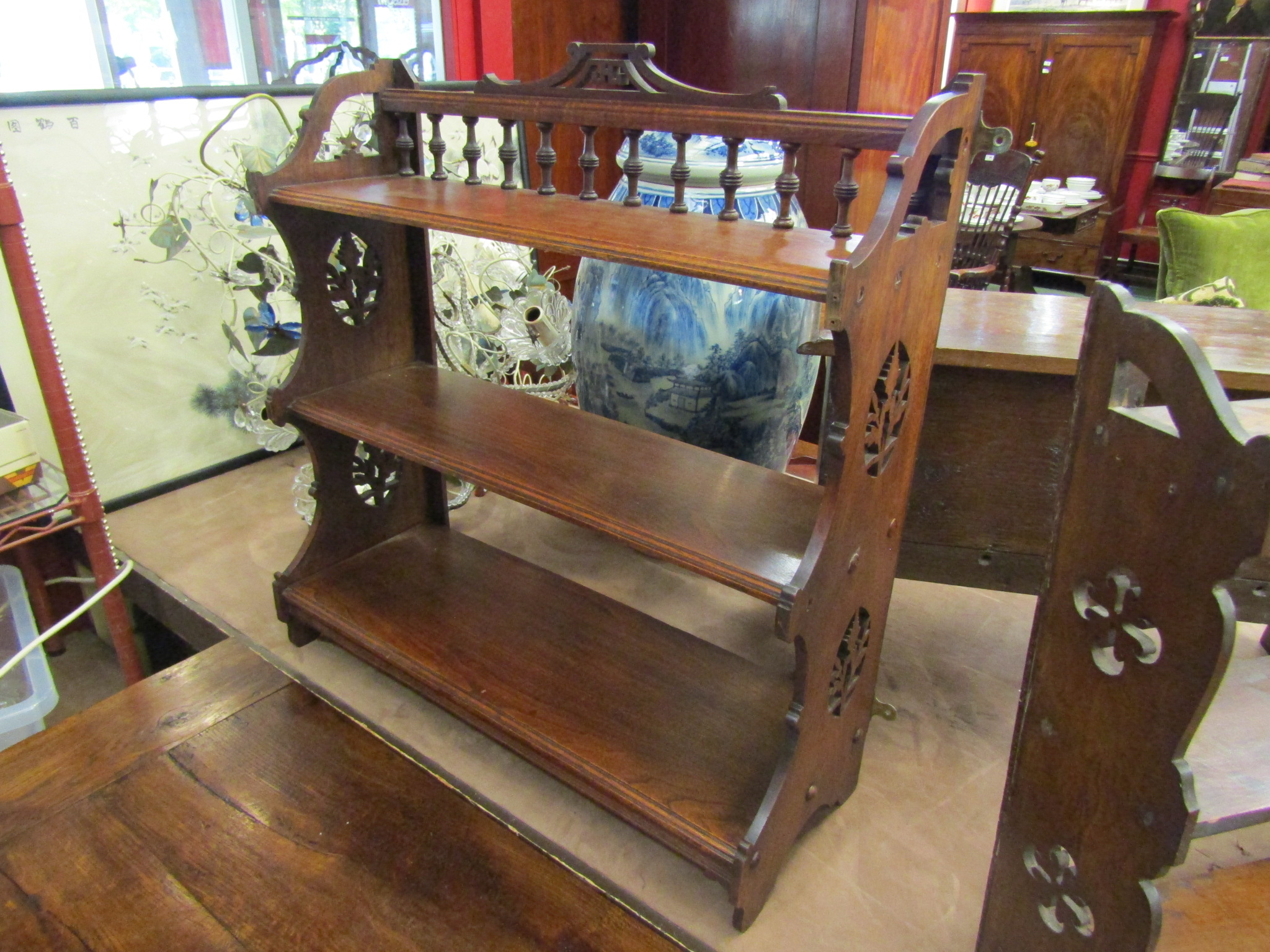 A late Victorian wall hanging three tier shelf with spindle and fret decoration 67cm x 68cm